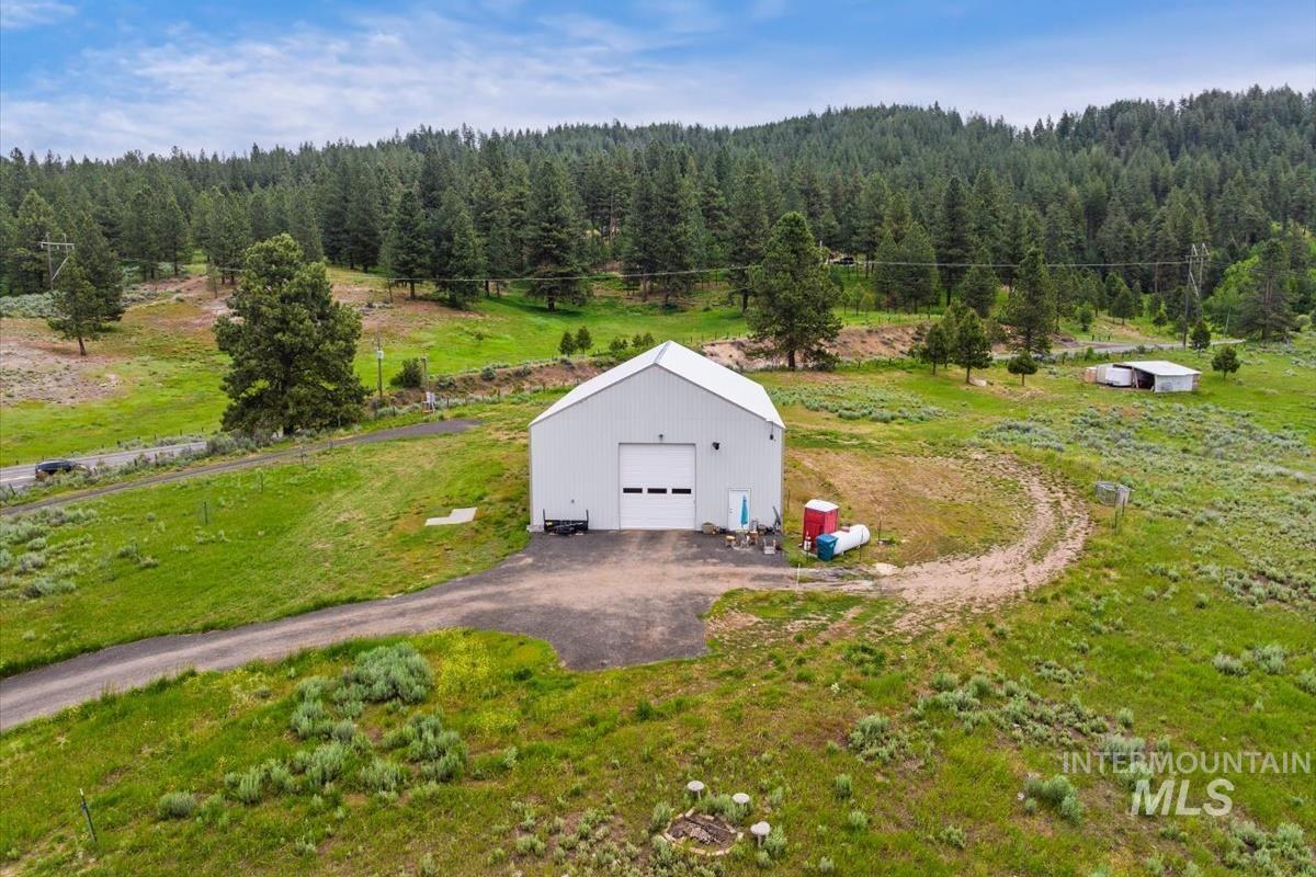 View from above of property featuring a forest