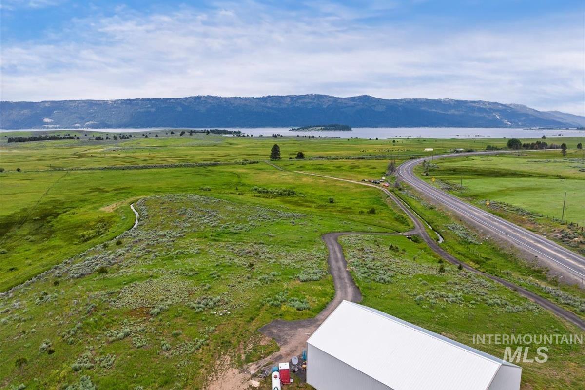 View of rural area featuring a water and mountain view and a pastoral area
