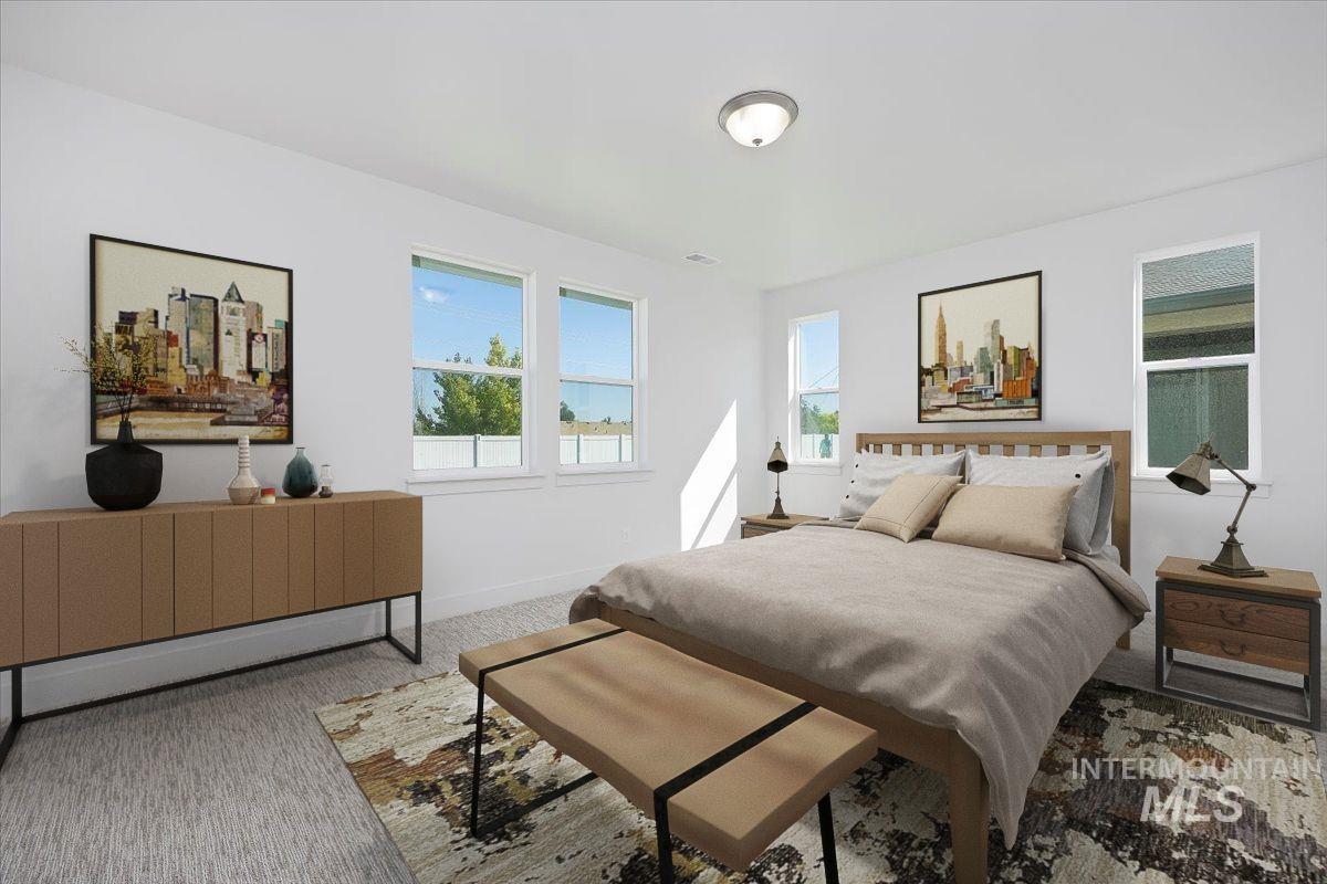 Carpeted bedroom featuring baseboards