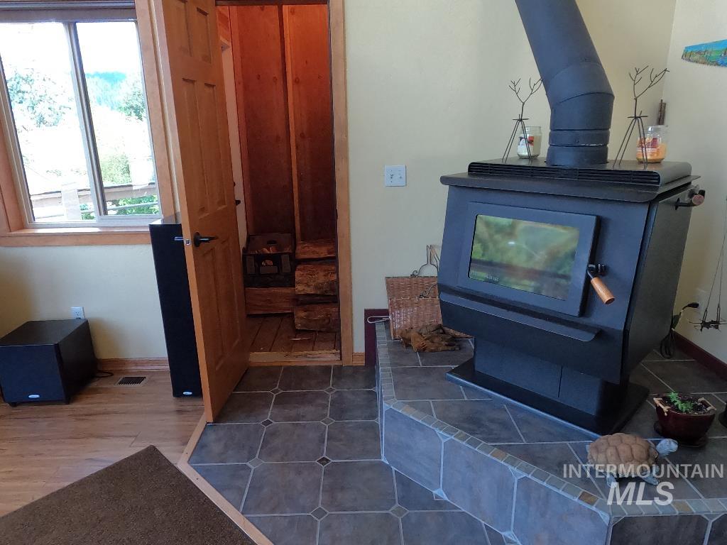 Detailed view of a wood stove and wood finished floors