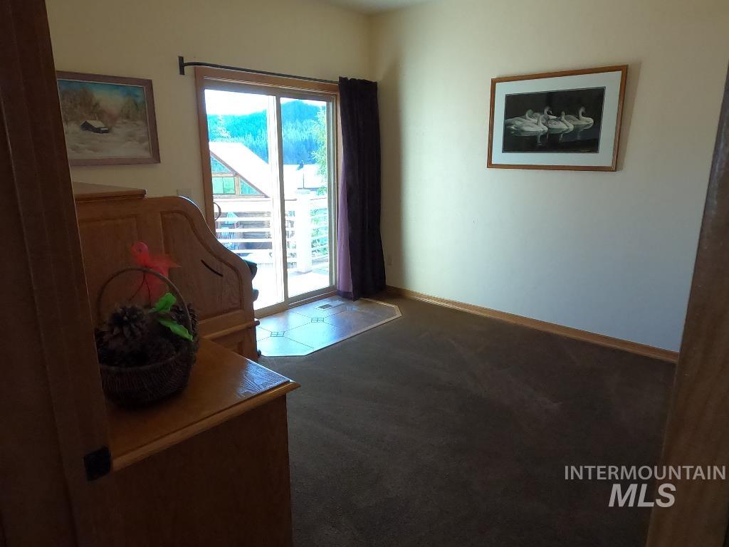 Entryway featuring healthy amount of natural light and carpet floors