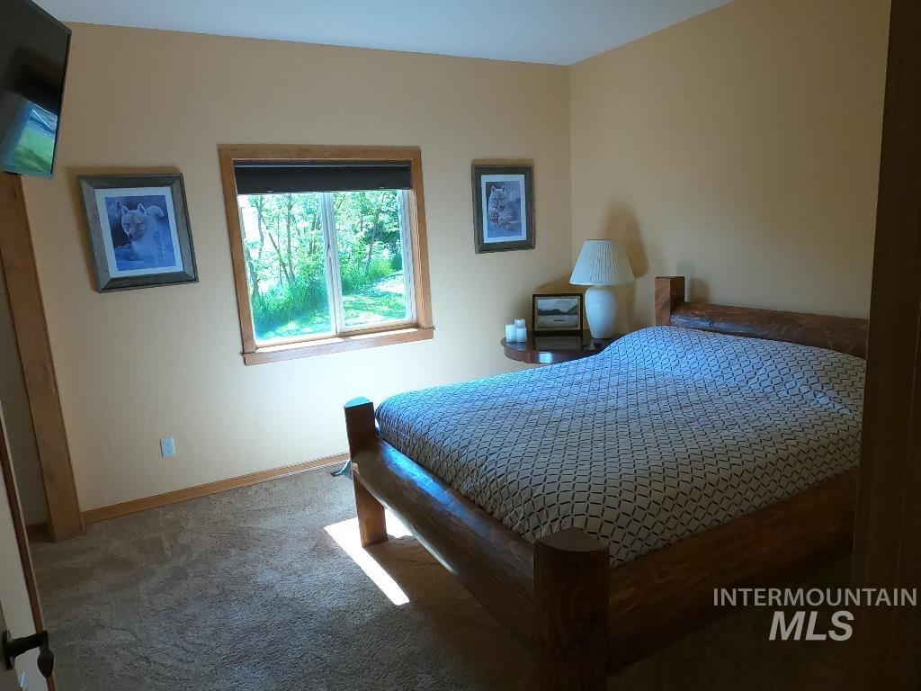 Carpeted bedroom with baseboards
