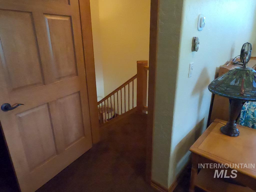 Corridor featuring an upstairs landing