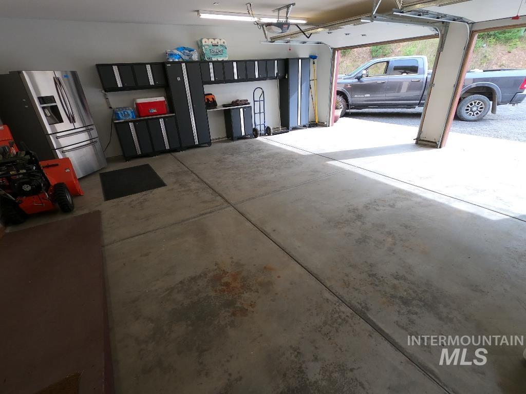 Garage with stainless steel fridge