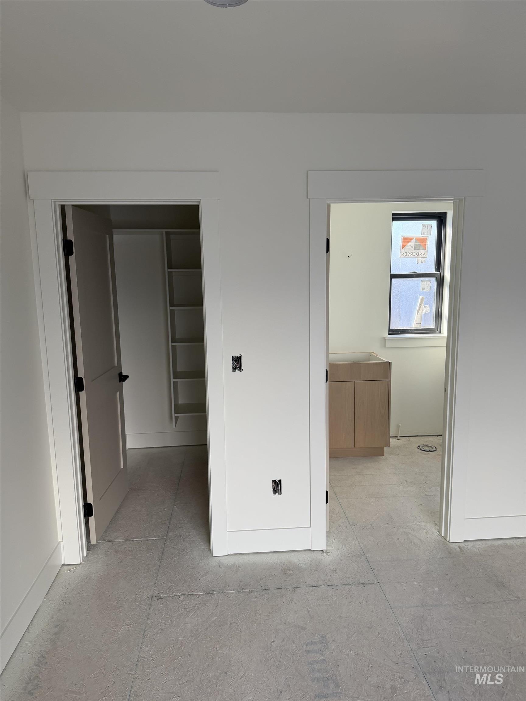 Unfurnished bedroom featuring connected bathroom