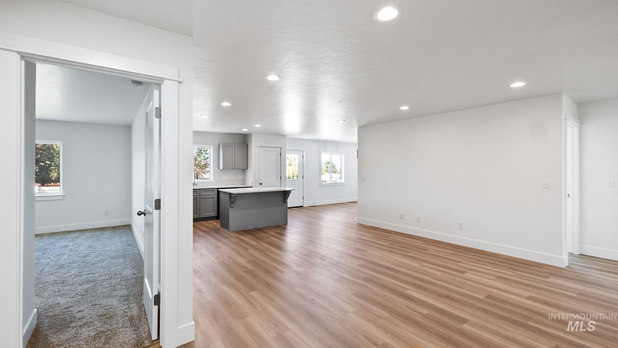 Unfurnished living room with recessed lighting and light wood-style floors