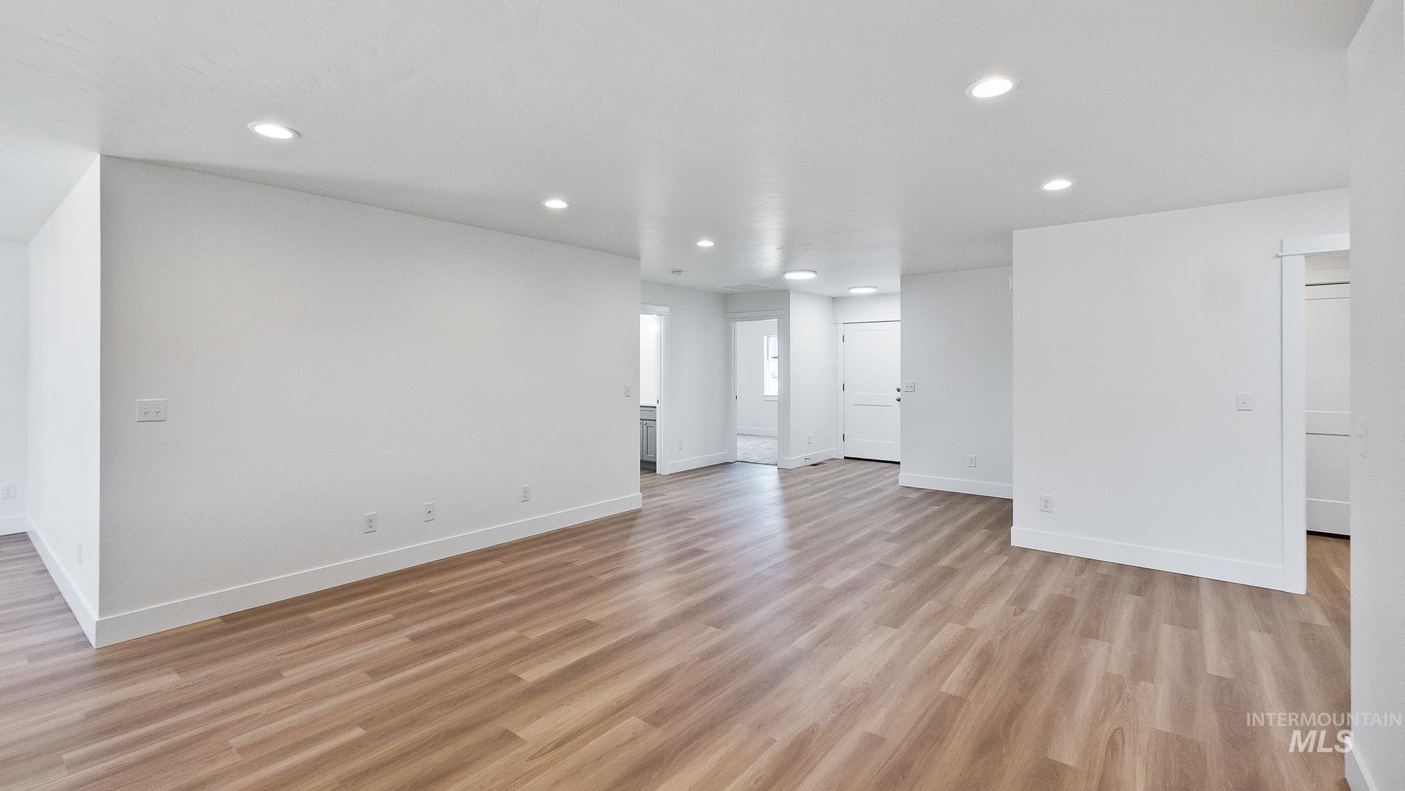 Unfurnished living room featuring recessed lighting and light wood-type flooring