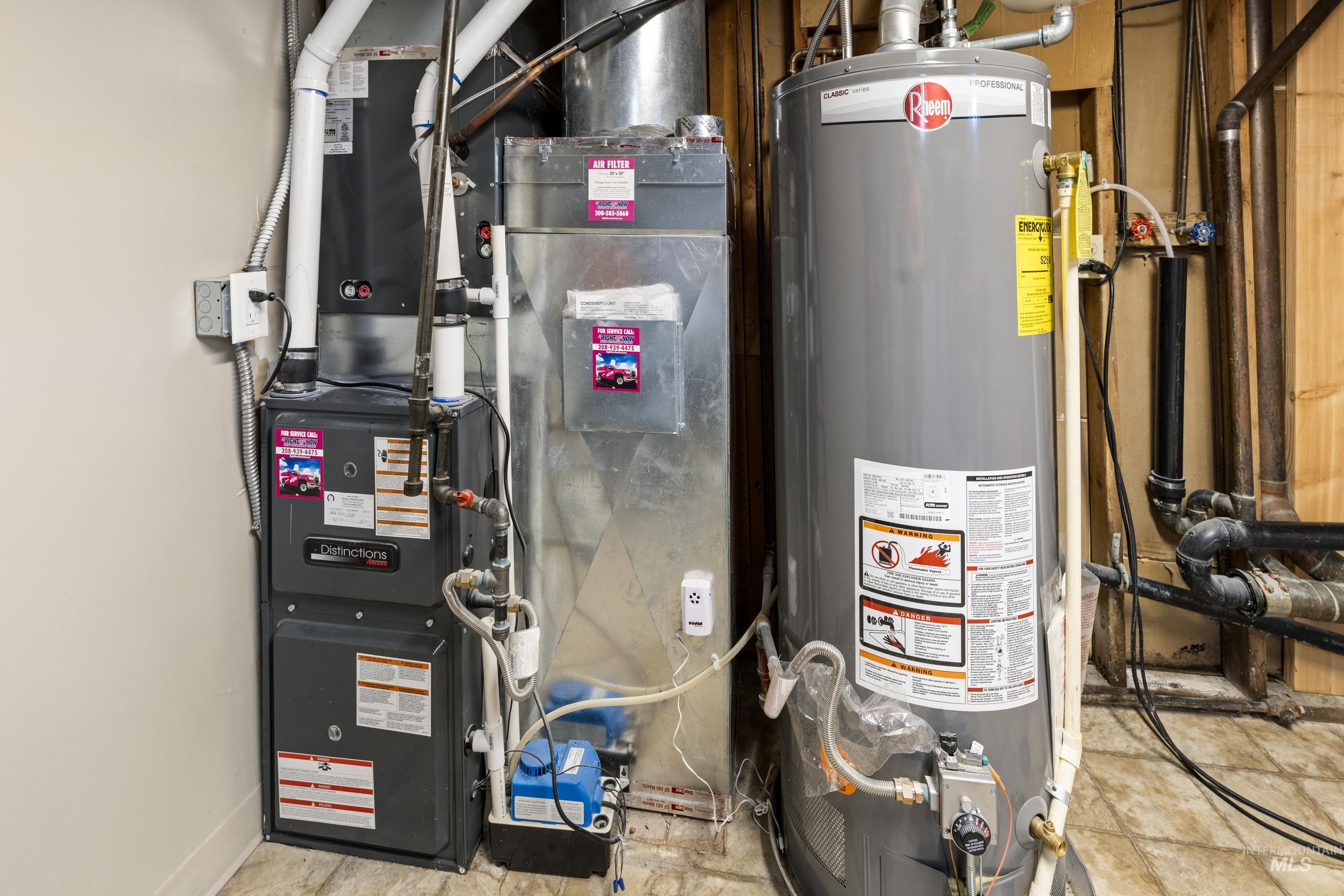 Utility room featuring gas water heater and heating unit