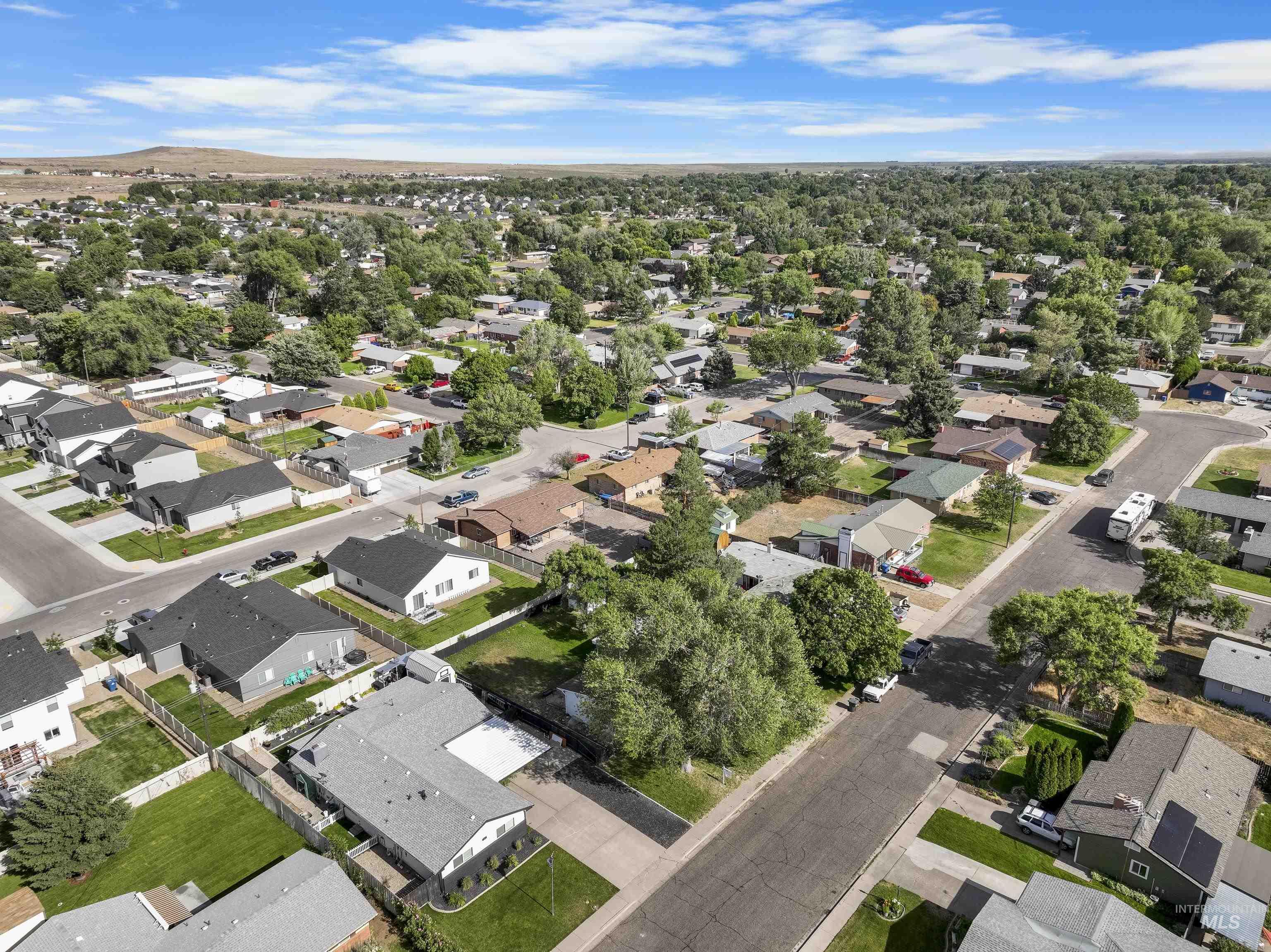 Aerial overview of property's location featuring nearby suburban area