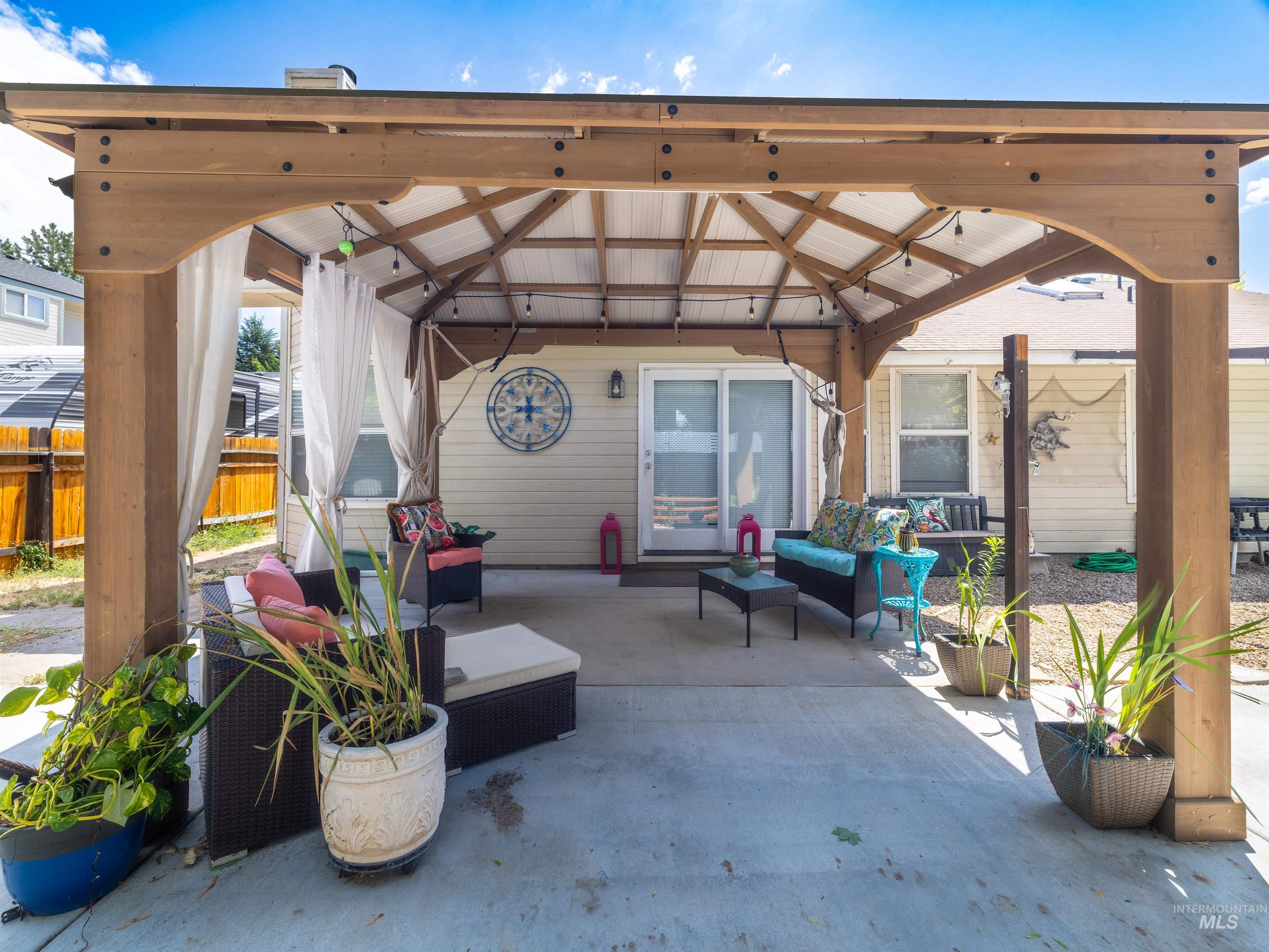 View of patio / terrace featuring an outdoor living space and a gazebo