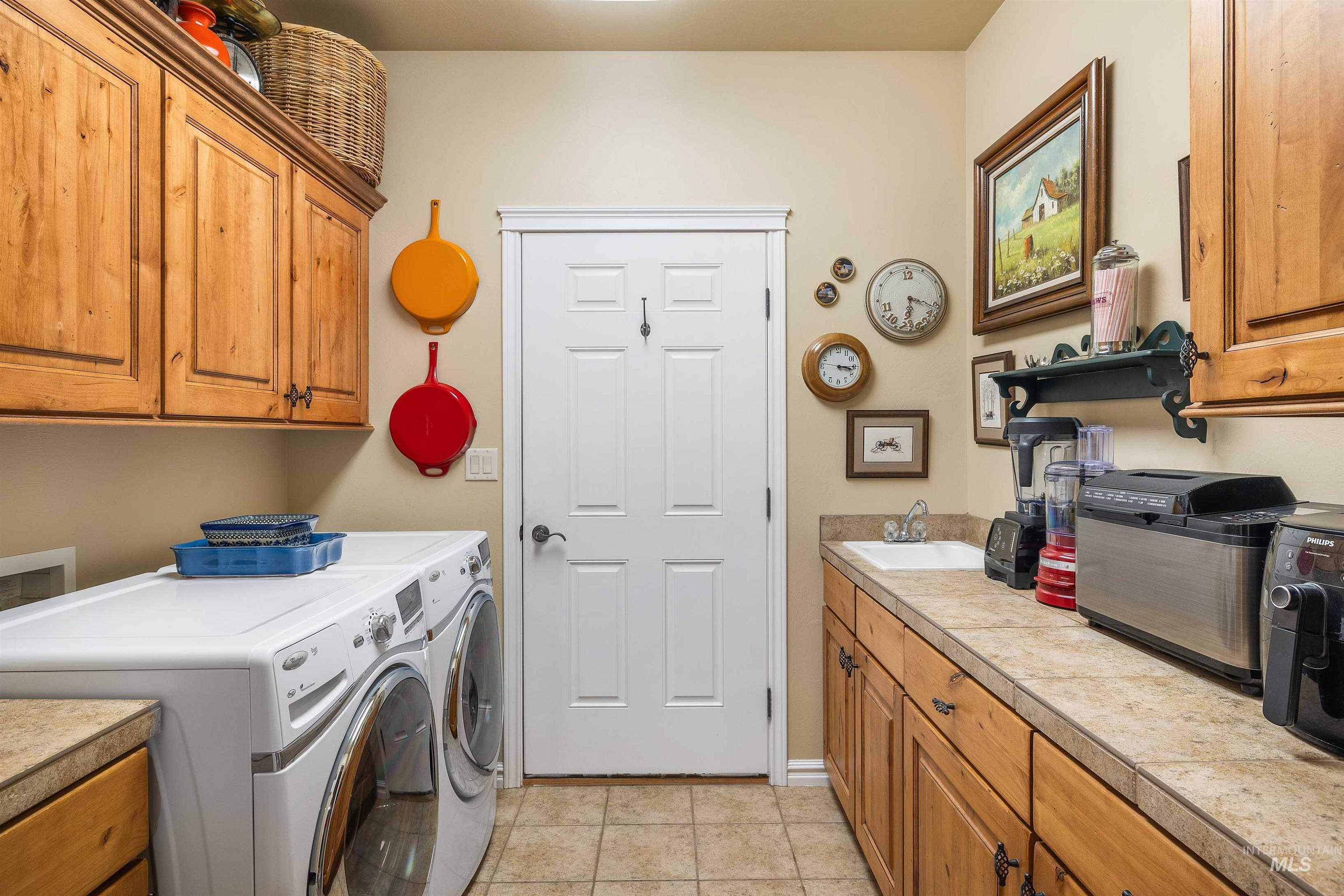 Lots of storage in this laundry room, just off the kitchen