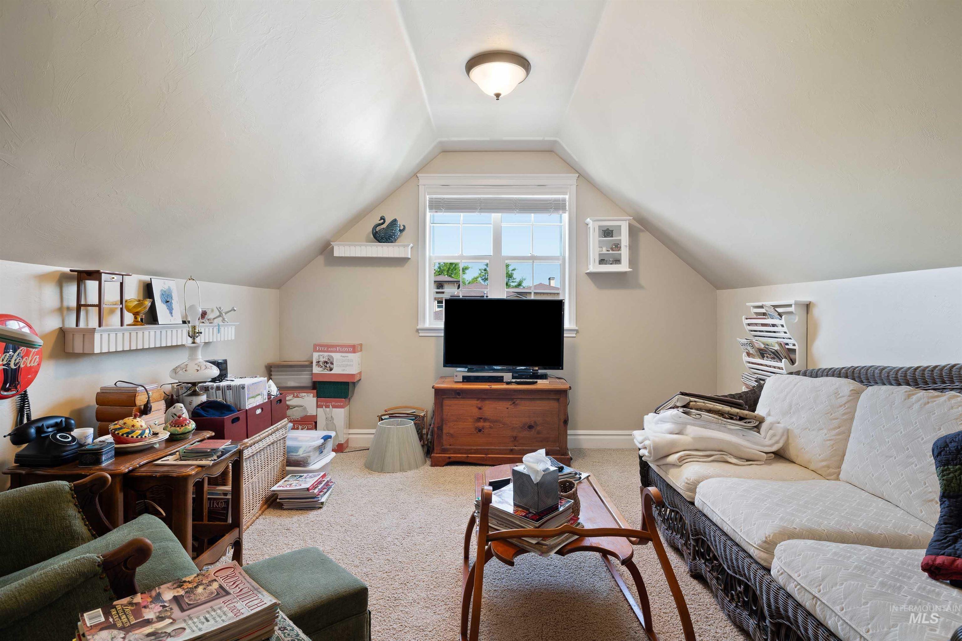 Carpeted bonus room/4th bedroom with lofted ceiling and 1/2 bath