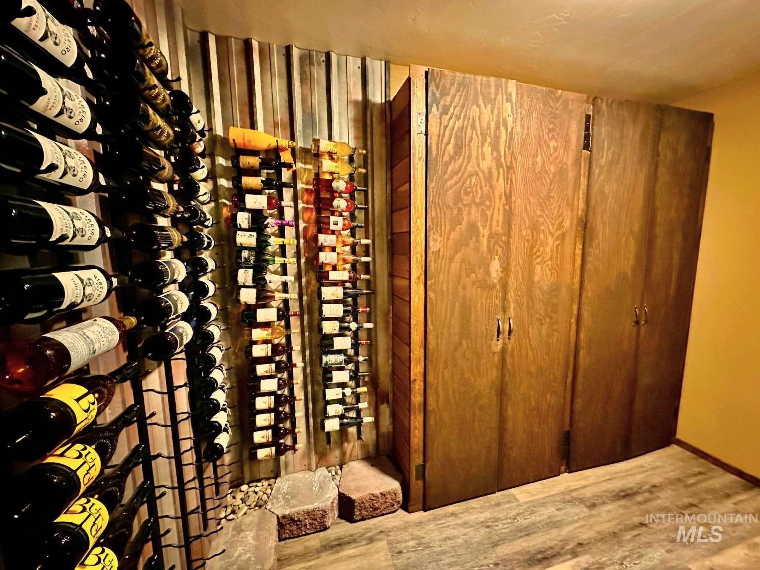 Wine area featuring wood finished floors