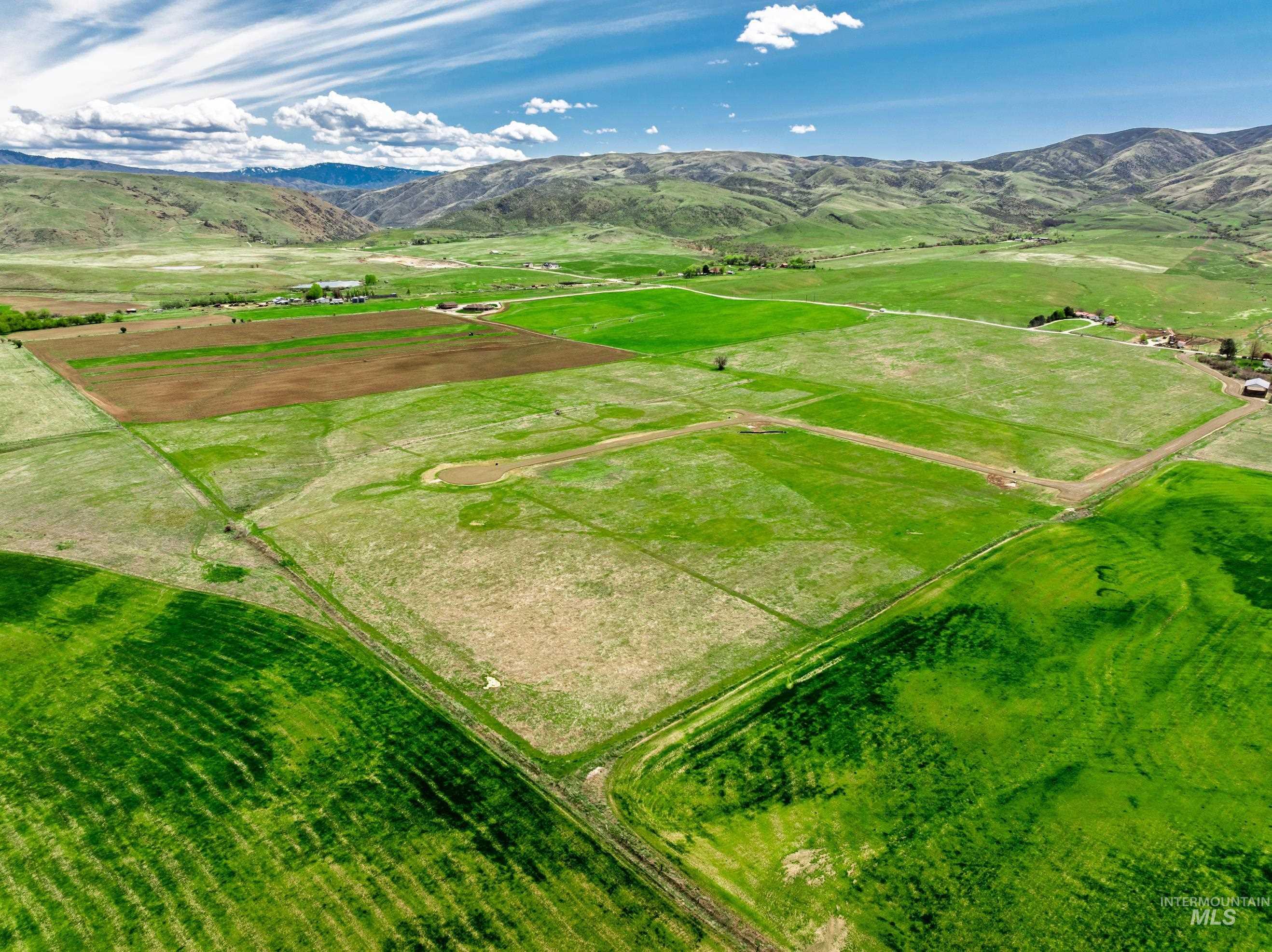 Overview of rural landscape with a mountain backdrop