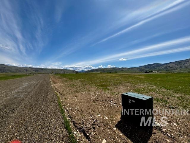 View of road featuring a mountain view and a view of countryside