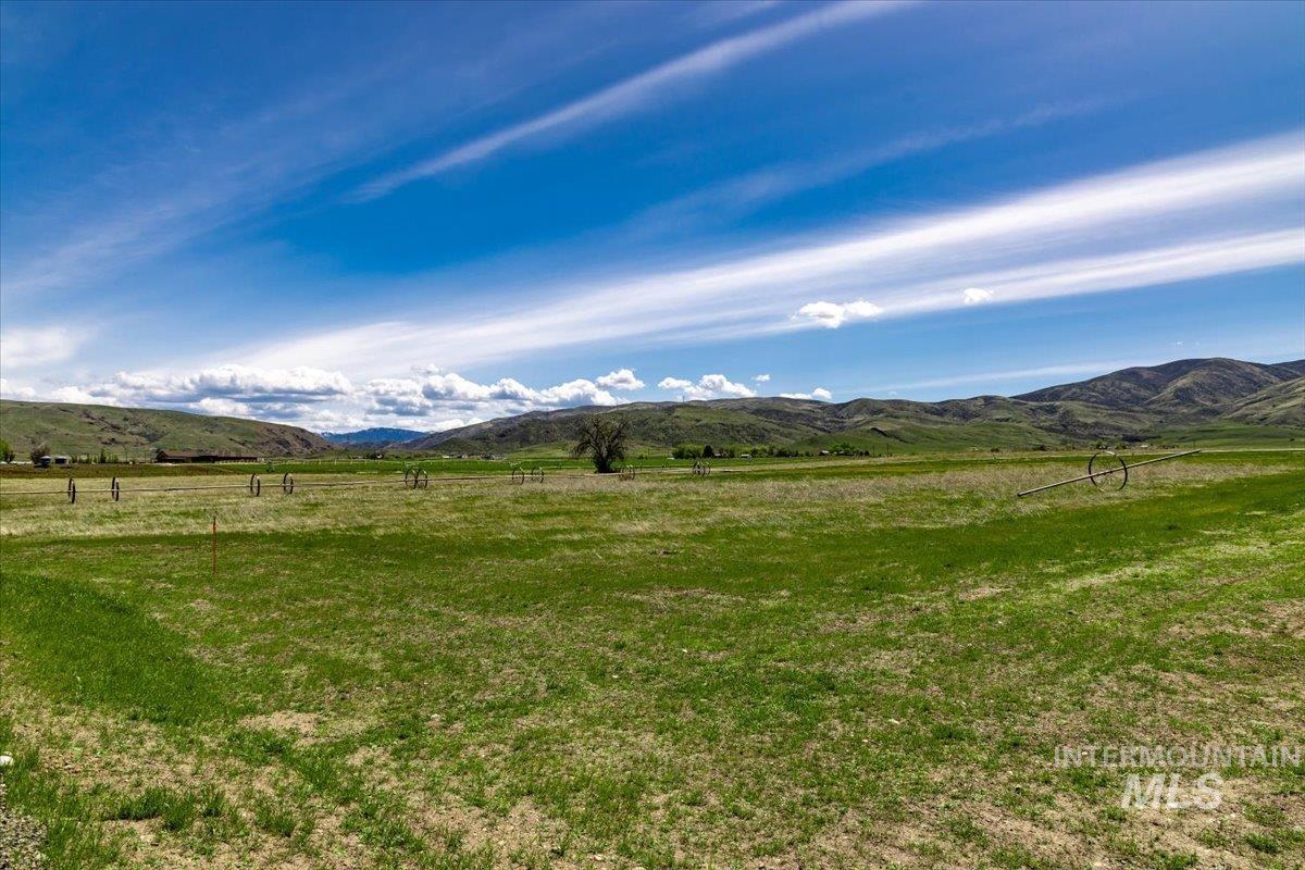 View of mountain backdrop with rural landscape
