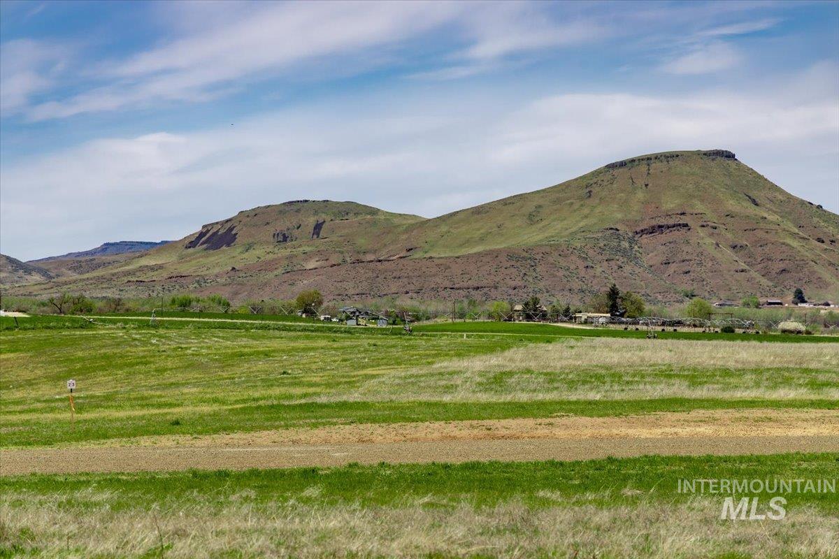 View of mountain background featuring rural landscape