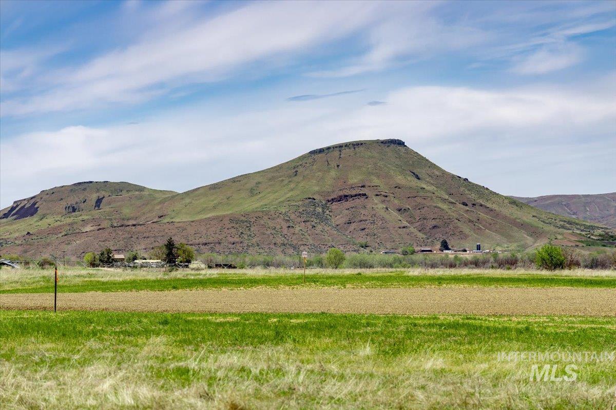 View of mountain background featuring rural landscape