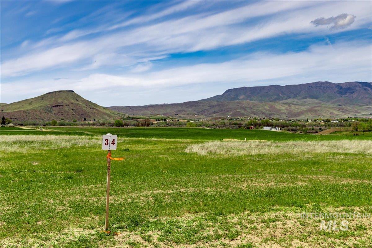 View of mountain backdrop featuring rural landscape