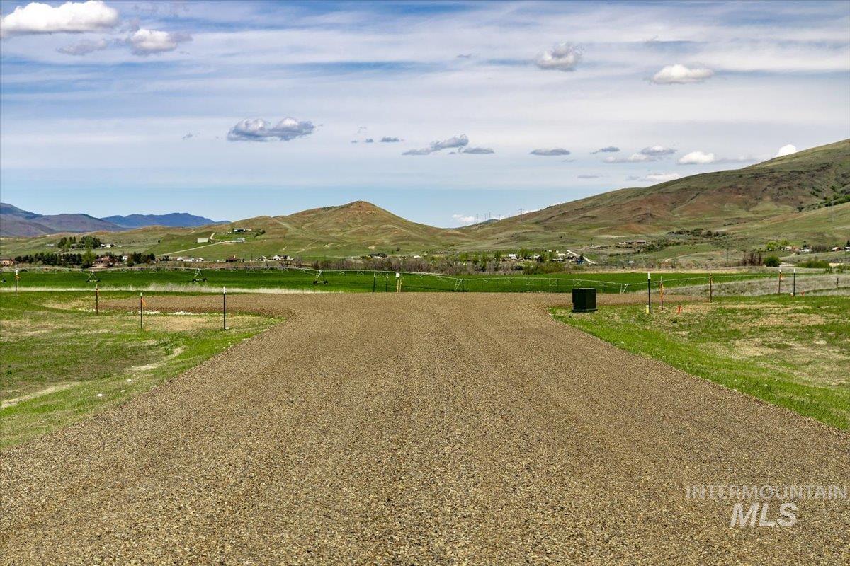 View of mountain background featuring rural landscape