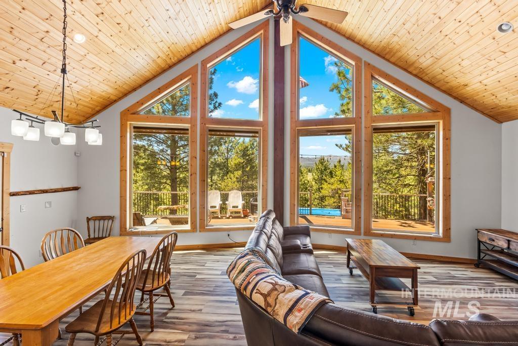 Sunroom featuring vaulted ceiling and healthy amount of natural light