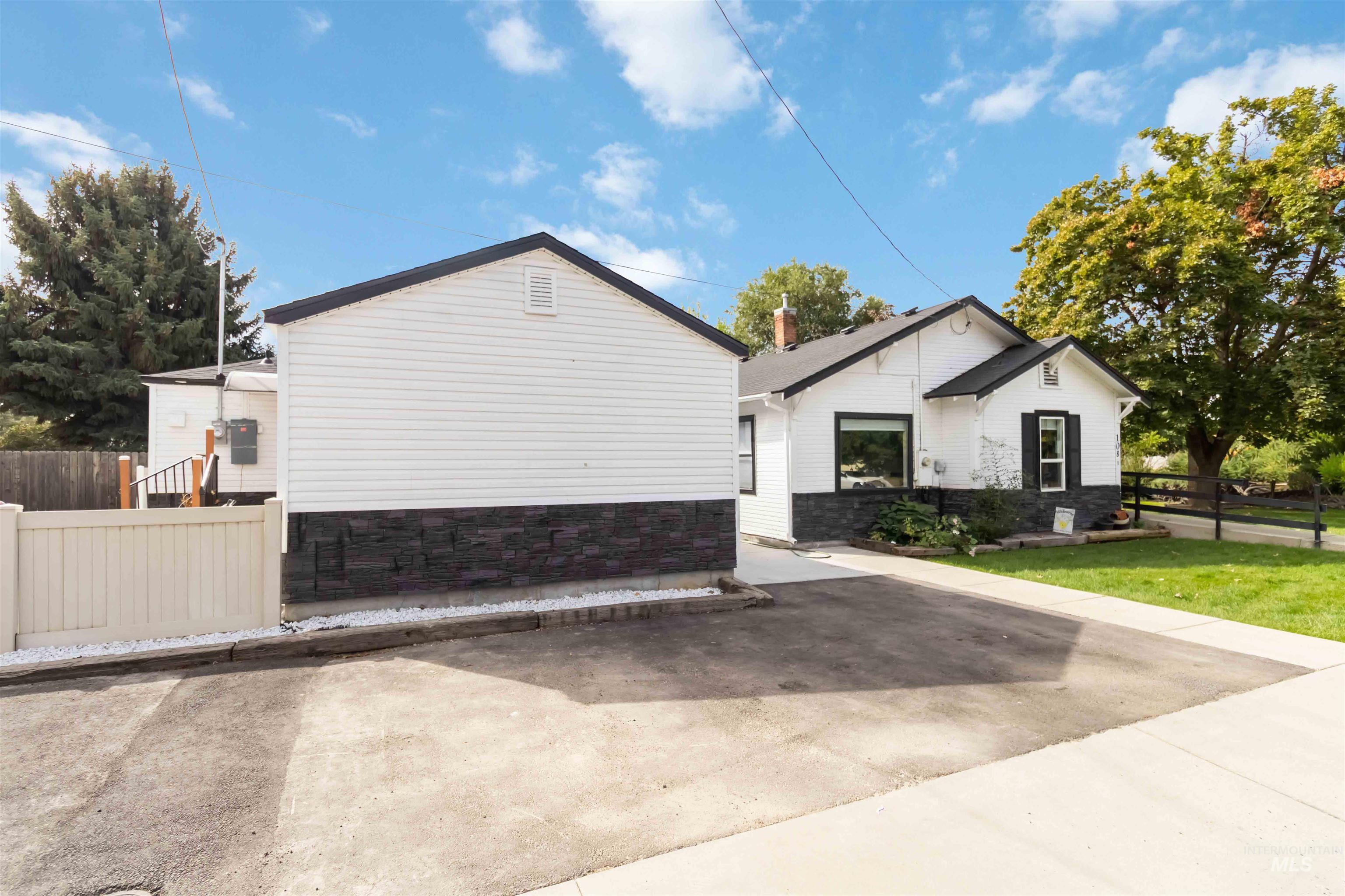 View of side of property with stone siding