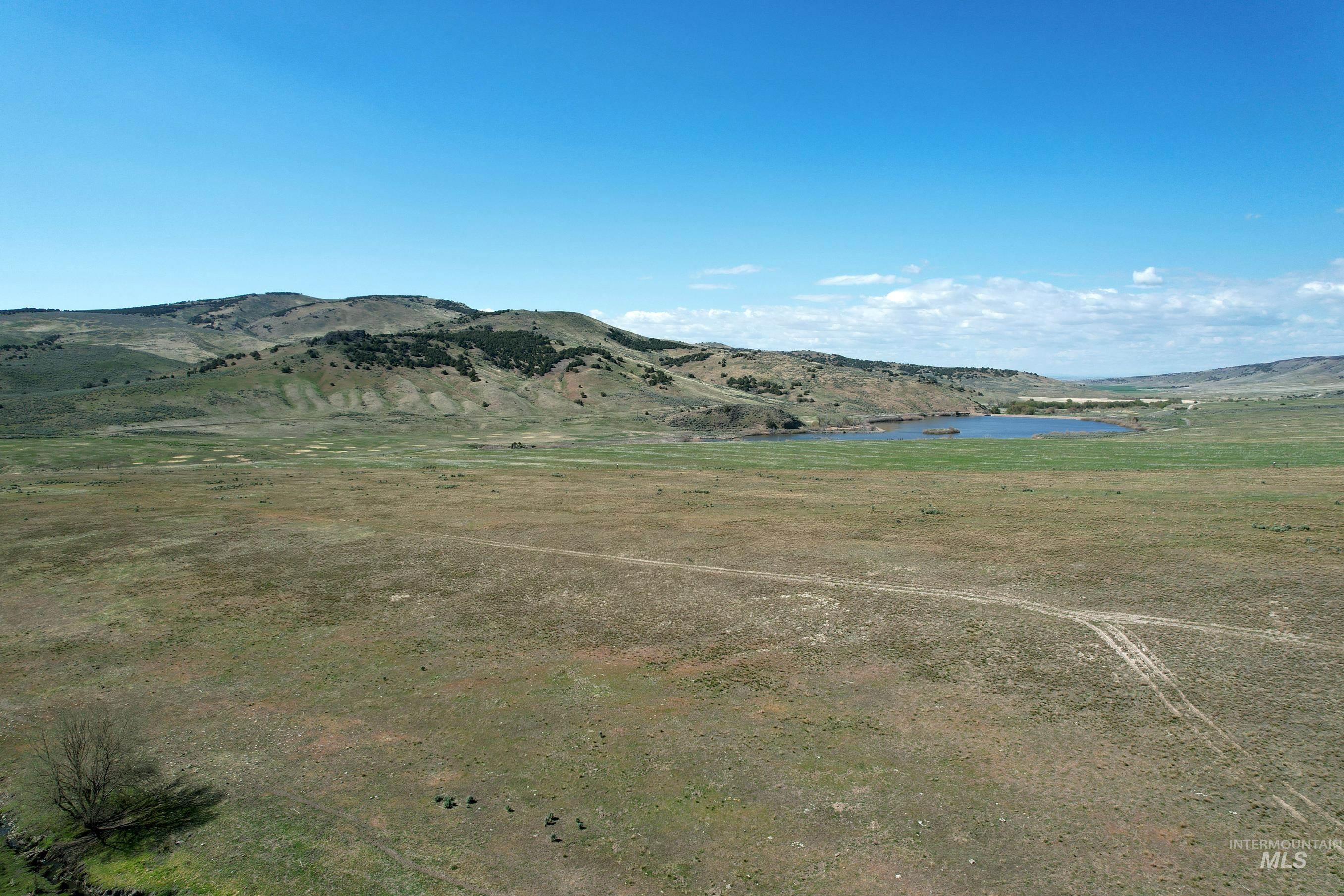 View of mountain backdrop featuring a large body of water
