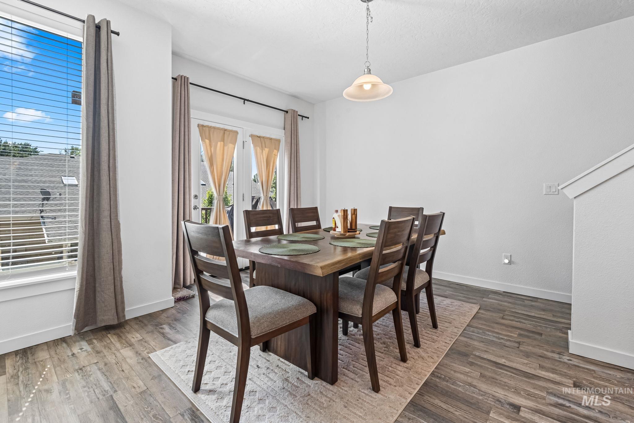 Dining area with wood finished floors and baseboards