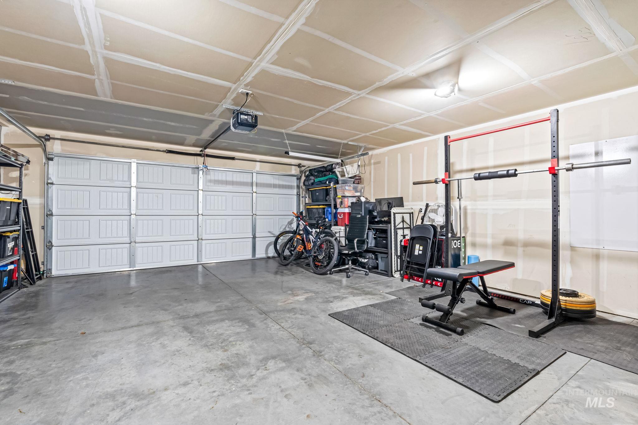 Garage featuring a garage door opener