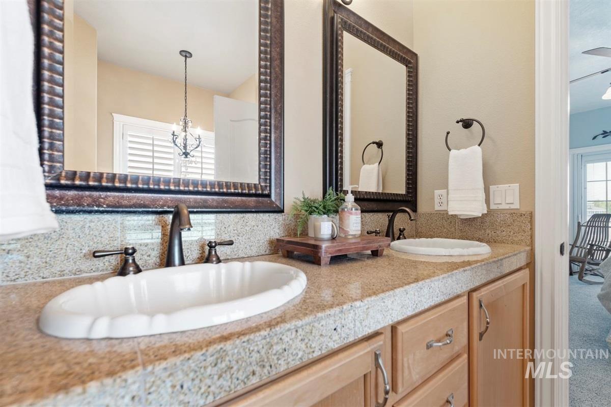 Bathroom with double vanity and backsplash