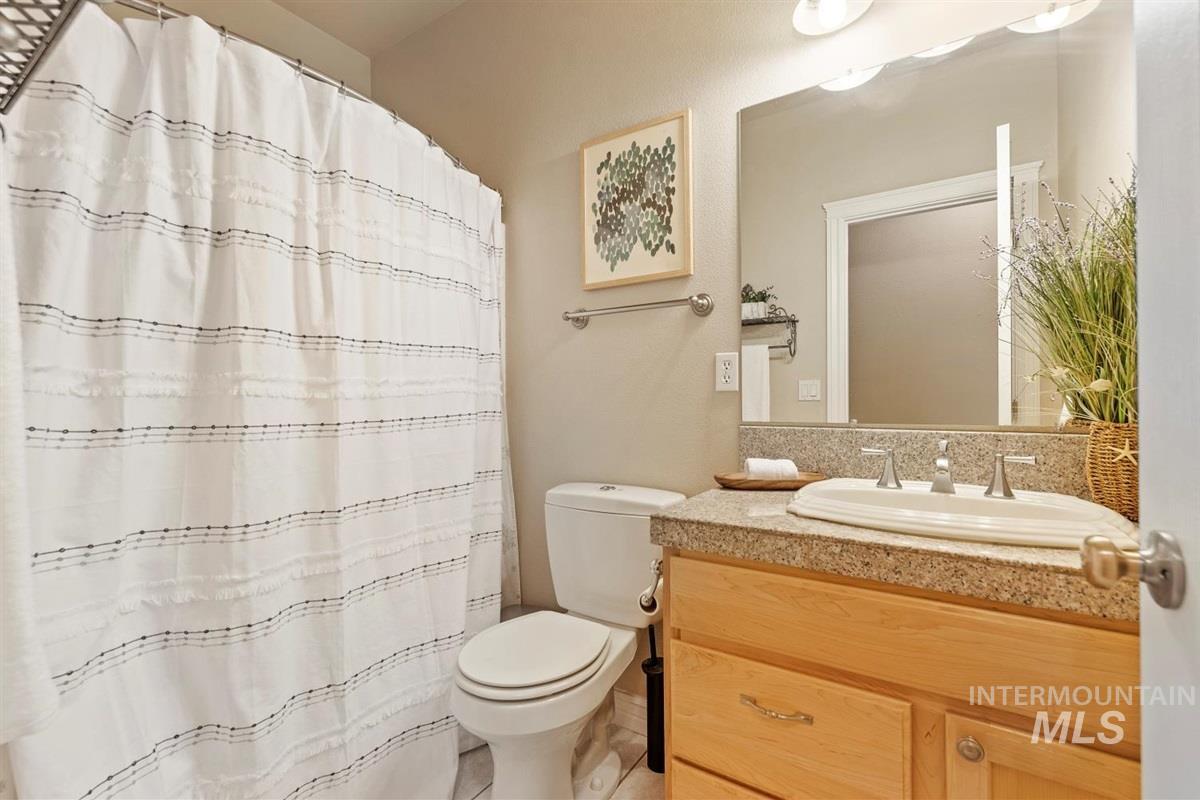 Bathroom with vanity and a shower with curtain