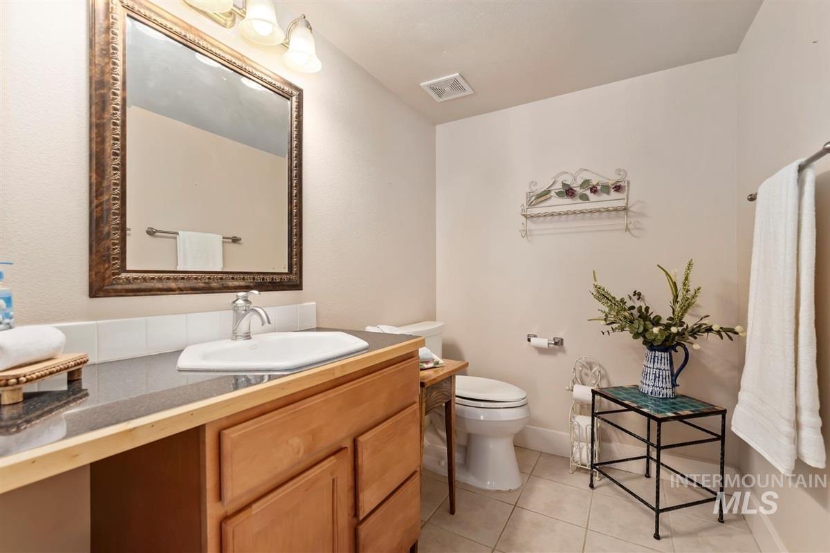 Bathroom featuring vanity and tile patterned flooring