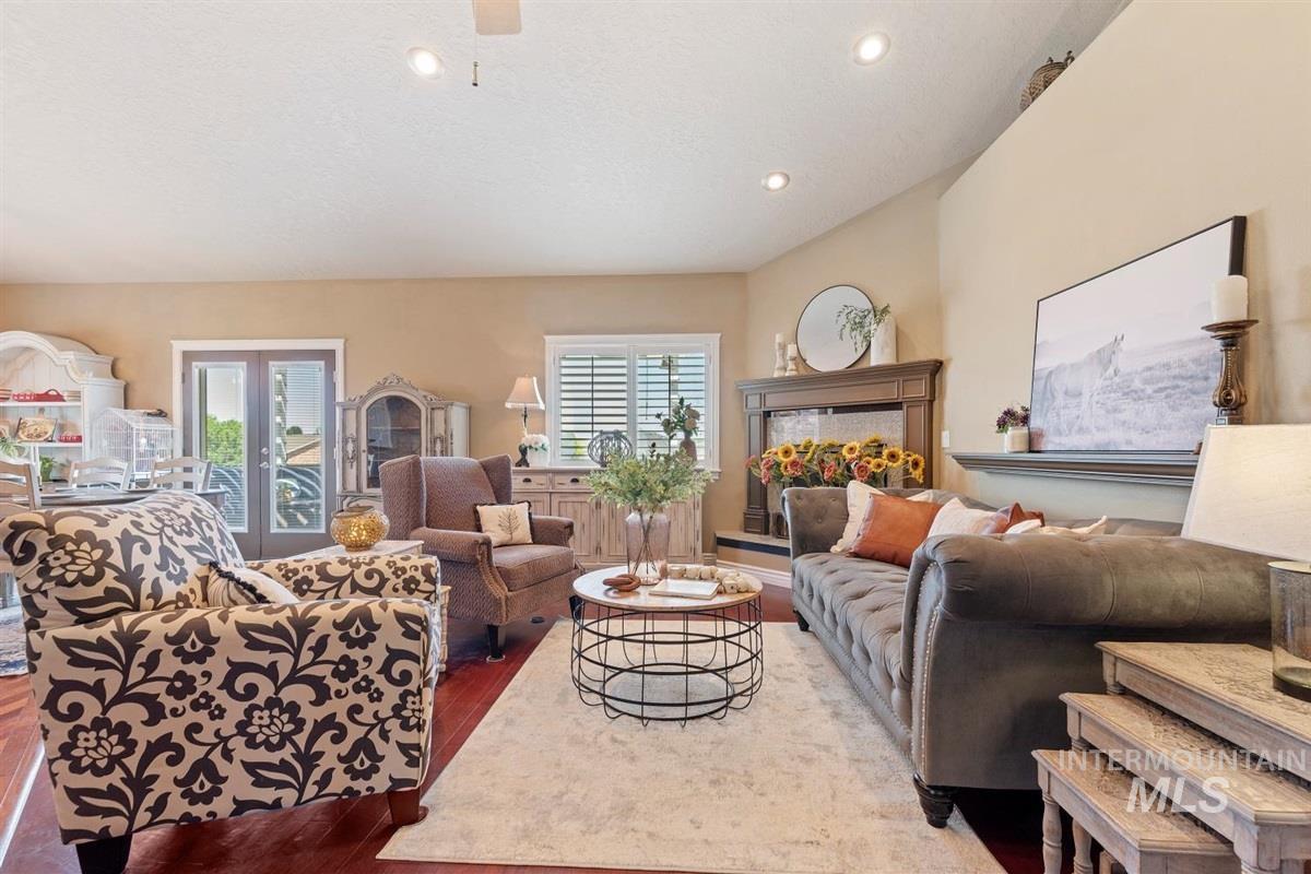 Living area with wood finished floors and recessed lighting