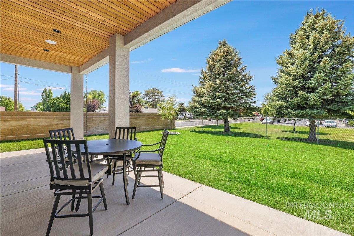 Fenced backyard featuring outdoor dining area and a patio area