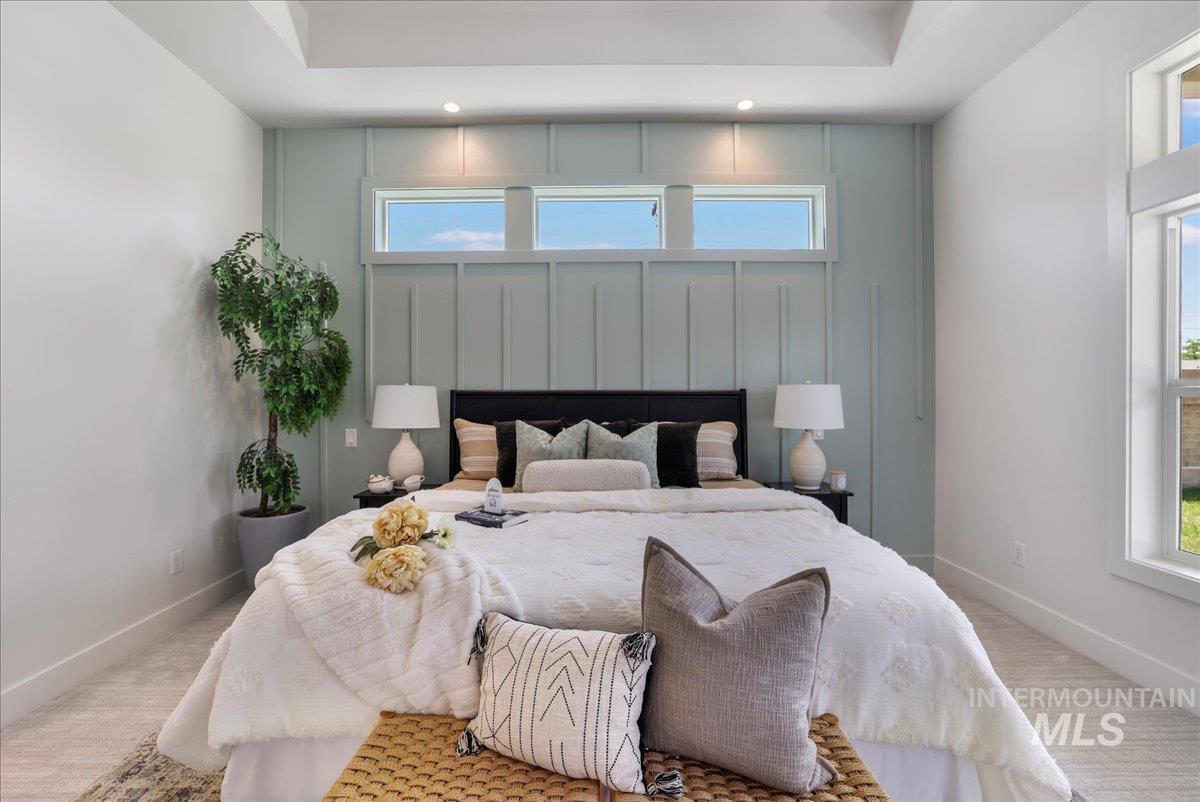 Carpeted bedroom with recessed lighting