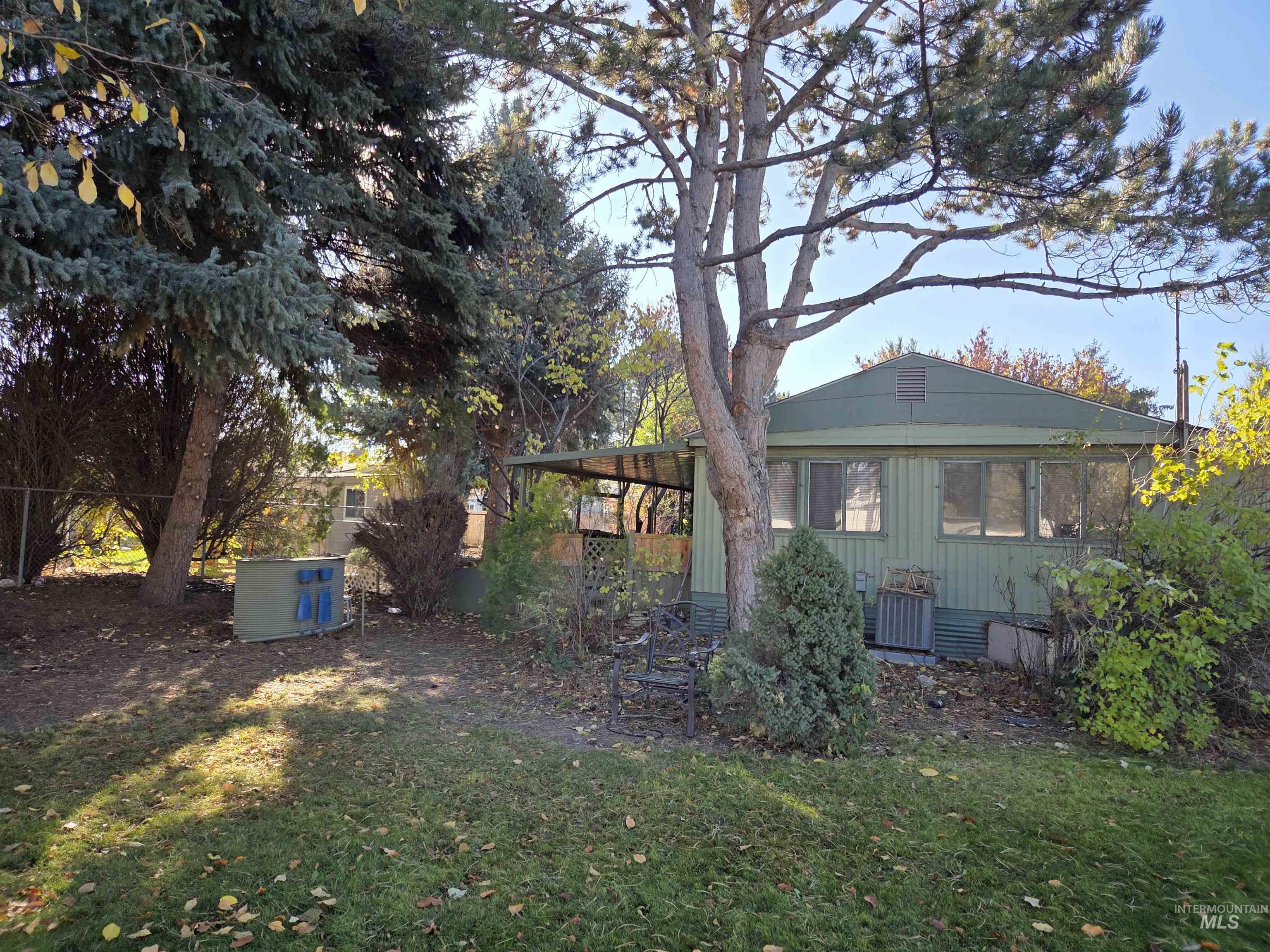 Rear view of property featuring a lawn