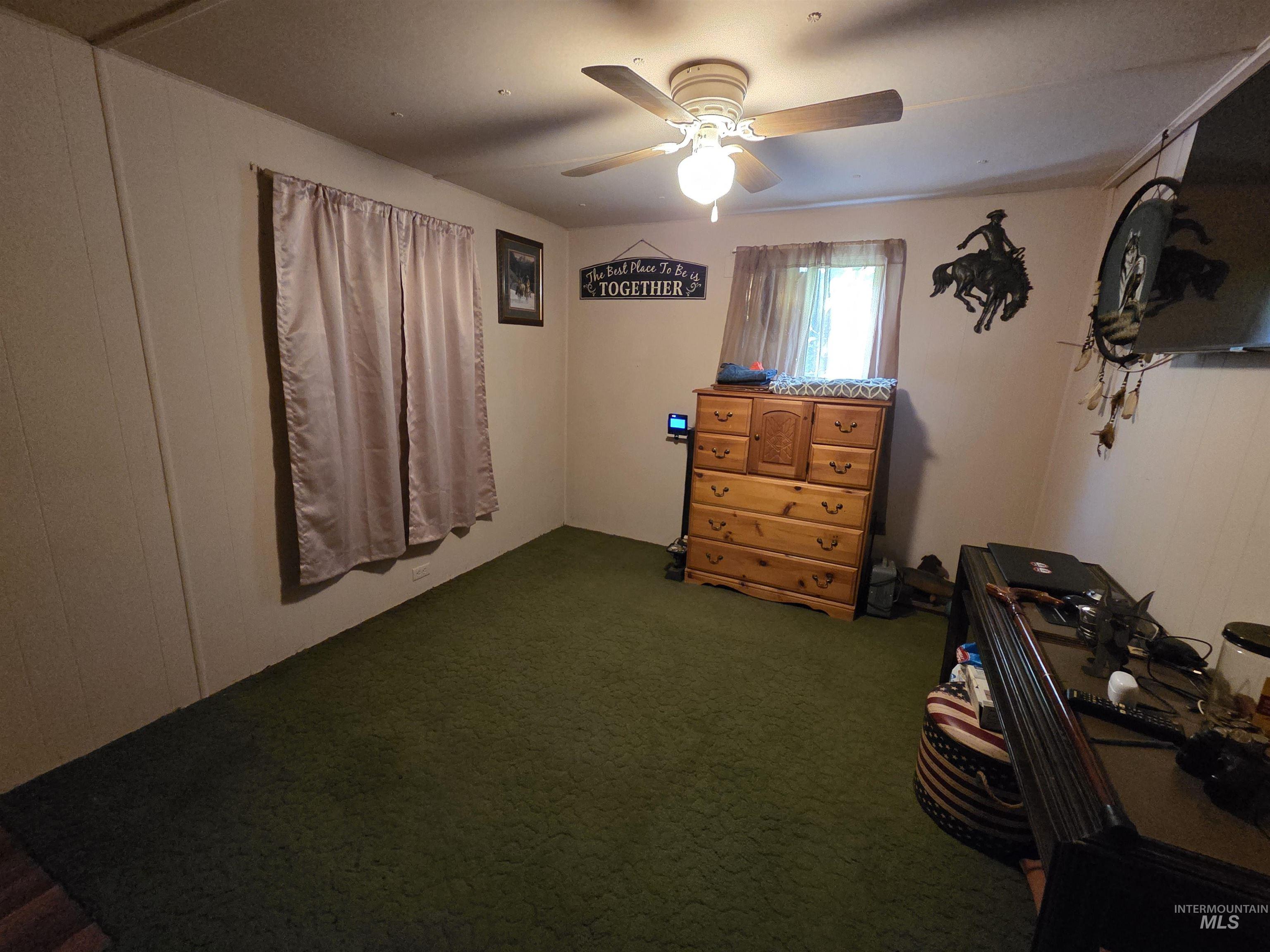 Bedroom with carpet floors and ceiling fan