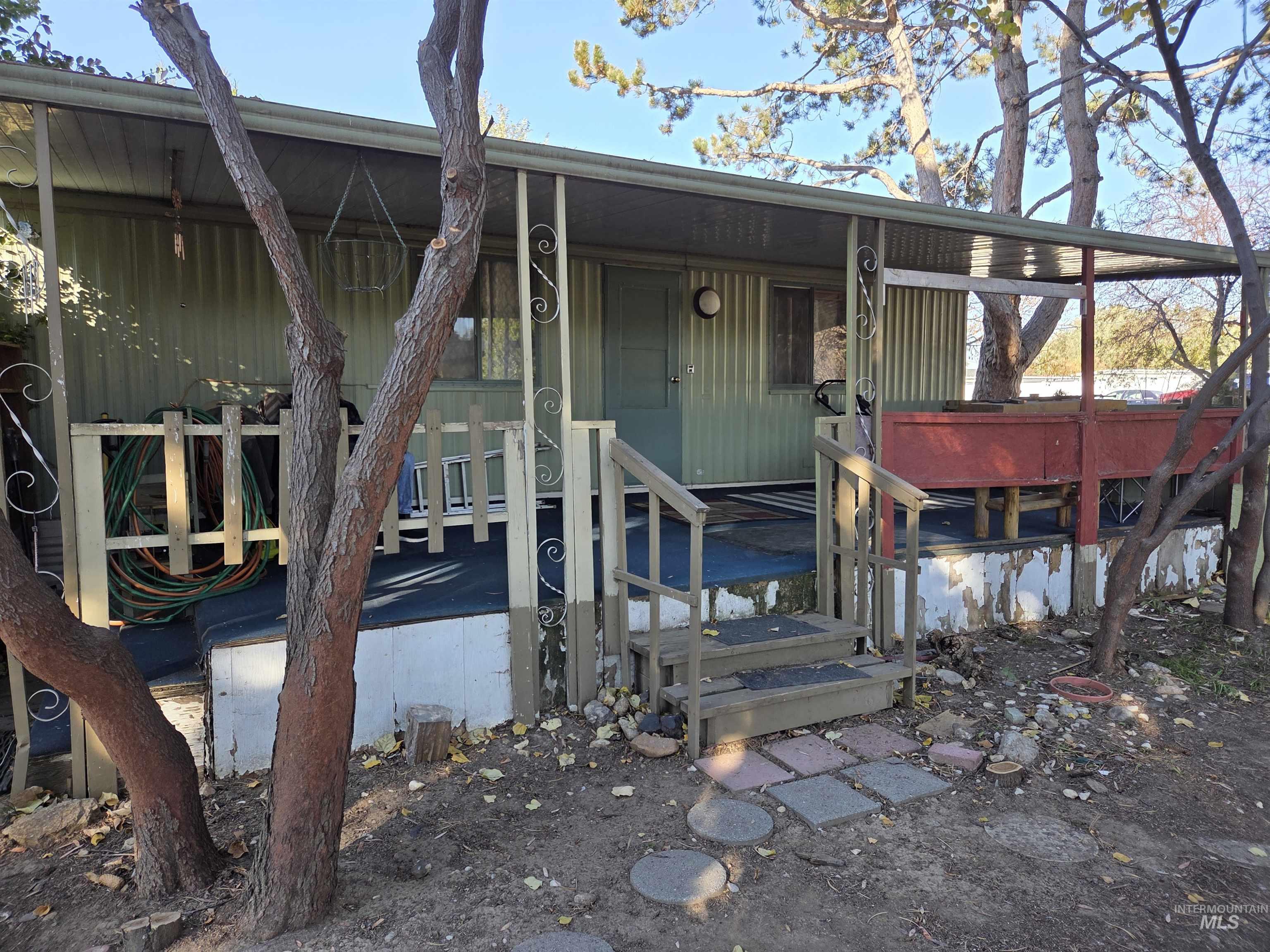 Entrance to property featuring a wooden deck