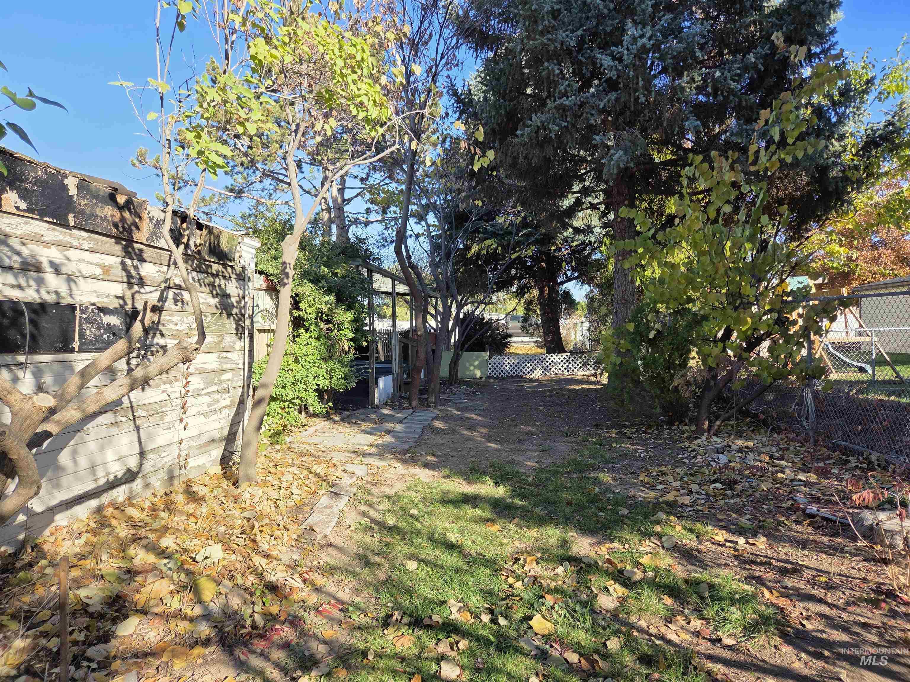 View of fenced backyard