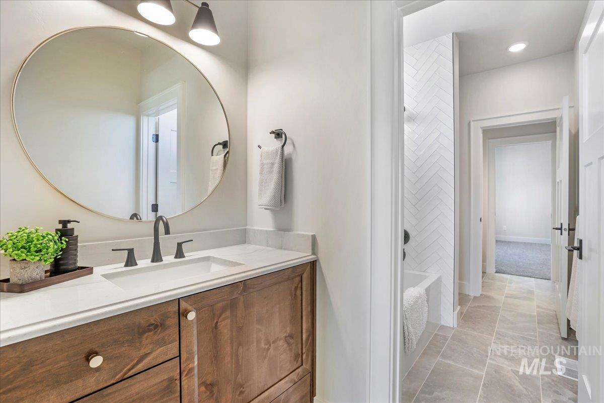 Full bathroom featuring vanity and tub / shower combination
