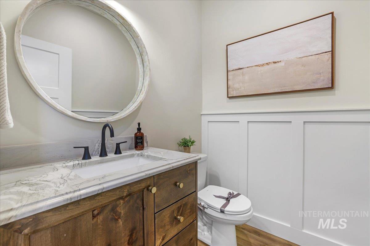 Bathroom with vanity and wood finished floors