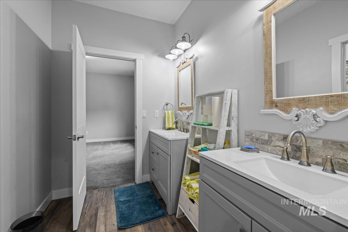 Bathroom with vanity and wood finished floors