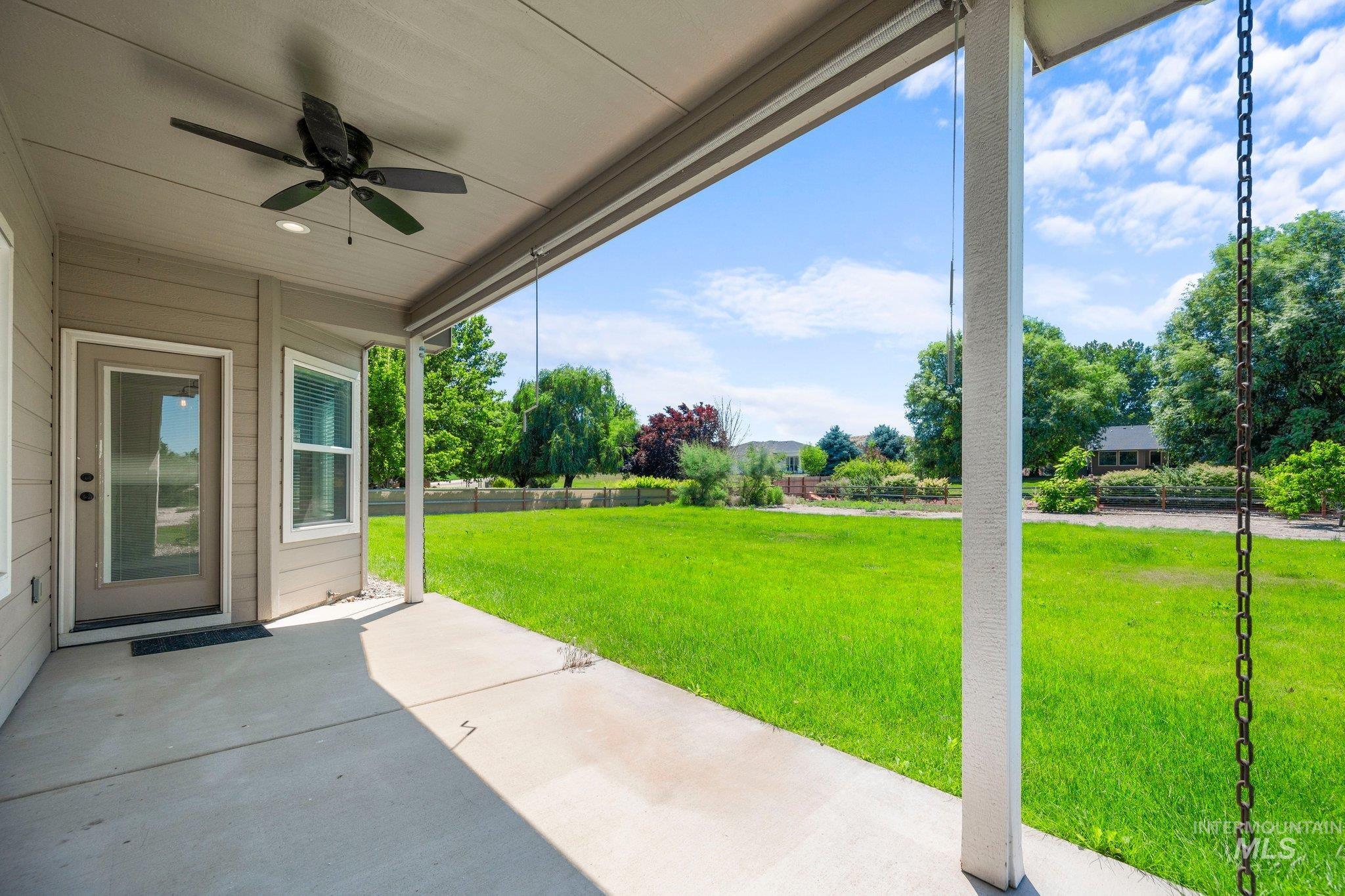 View of patio with a ceiling fan