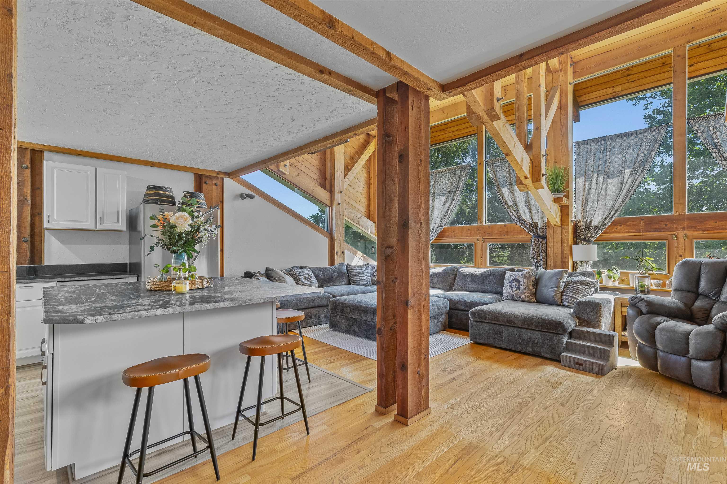 Living room with light wood-style flooring