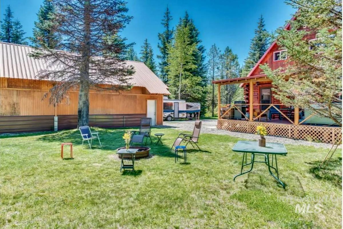 View of play area featuring a deck and a yard