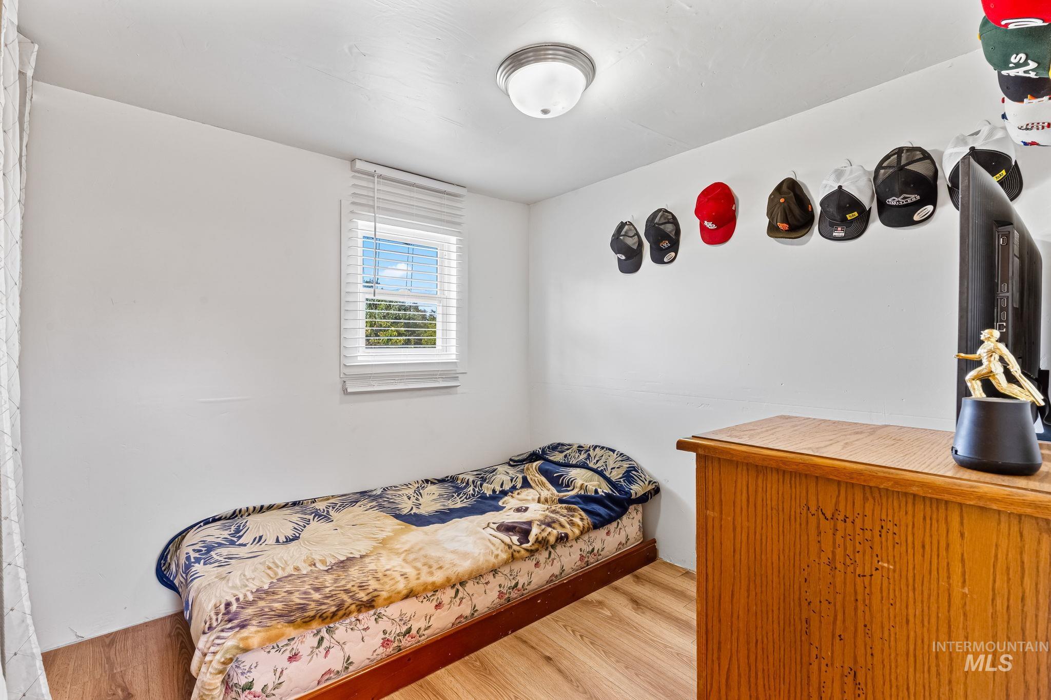 Bedroom featuring wood finished floors