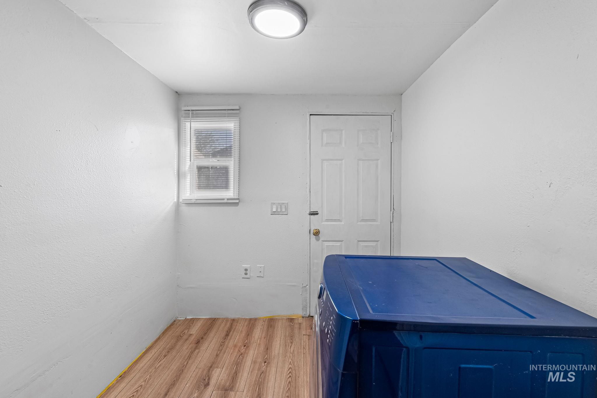 Washroom with light wood-type flooring