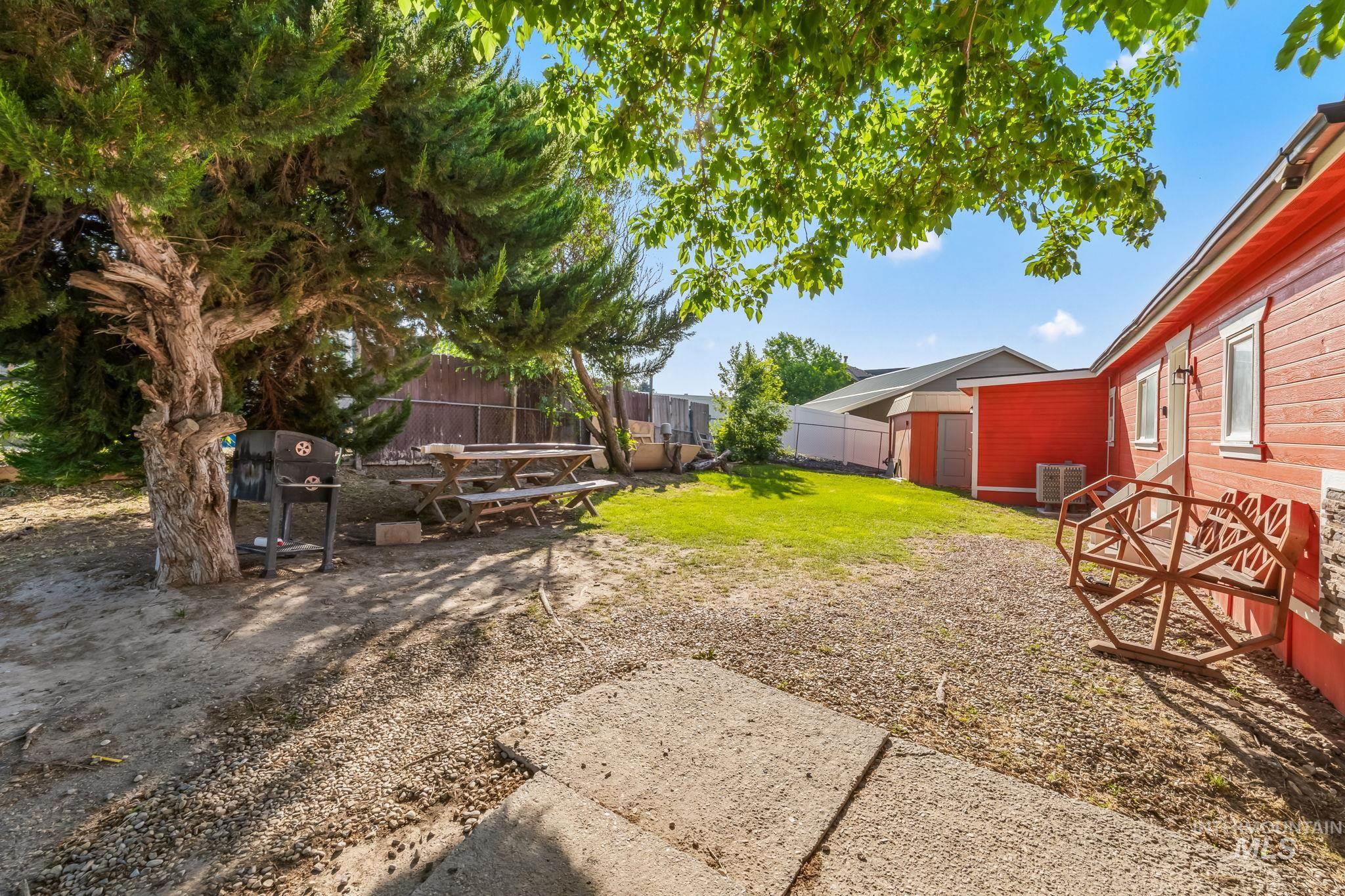 View of yard with a patio area and a shed