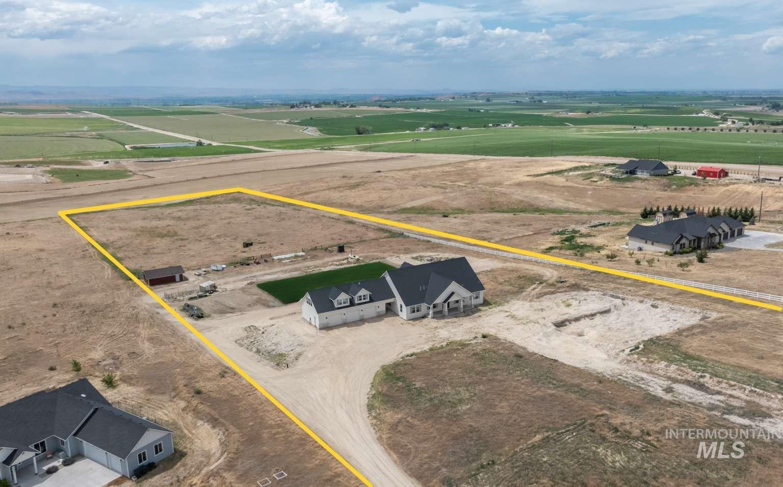 Aerial view of sparsely populated area with property boundaries highlighted