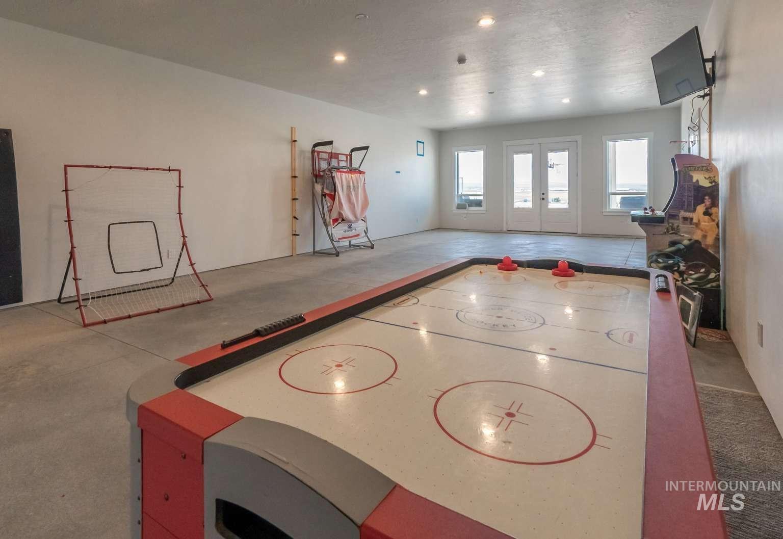 Game room with french doors and recessed lighting